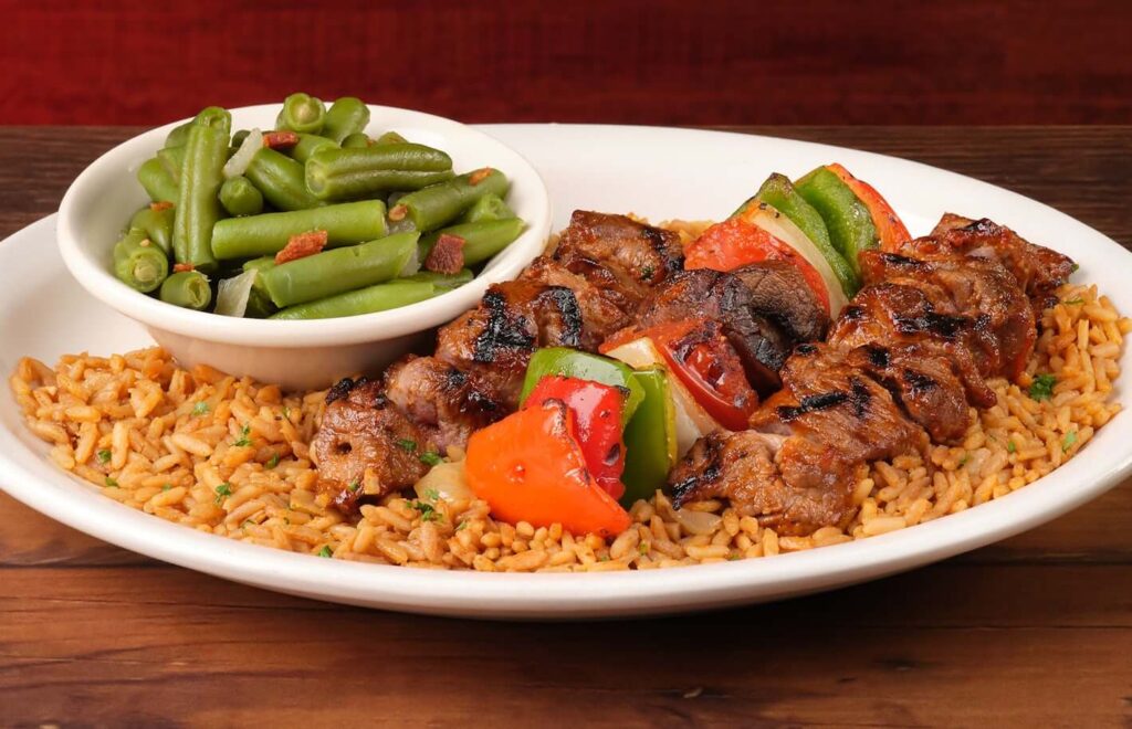 steaks with greens meat and with rice in texas roadhouse handcut menu